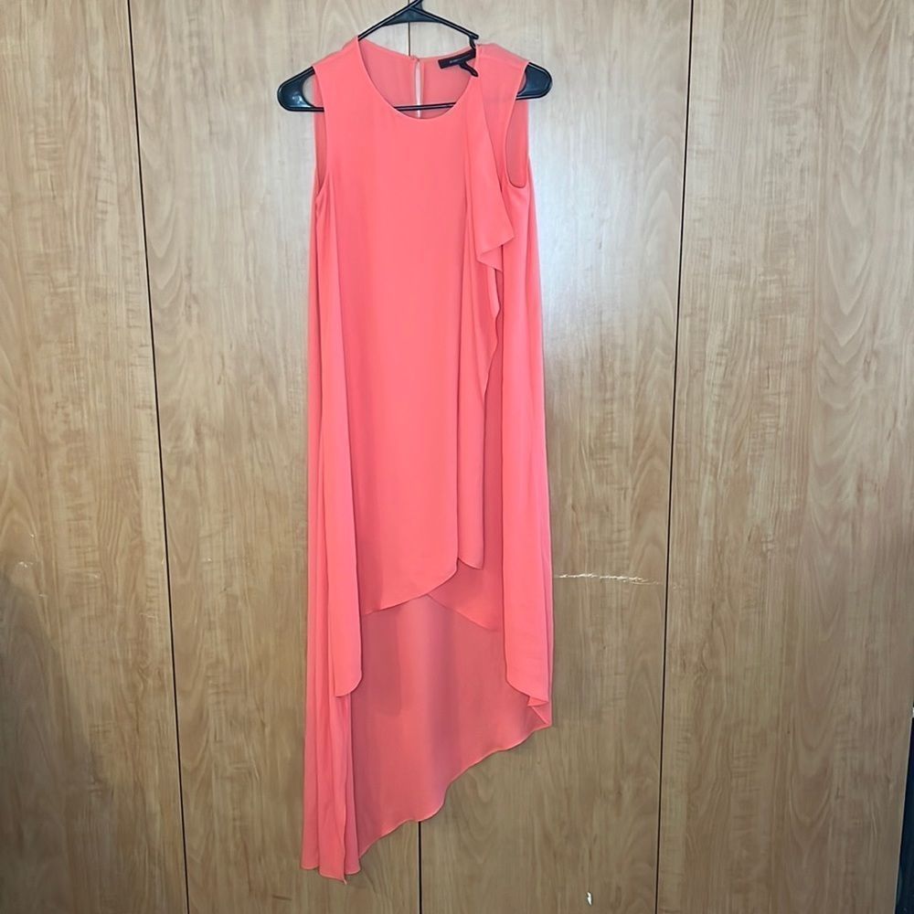 BCBG Maxazria XXS coral dress. Shorter in front then back. Ruffle down front